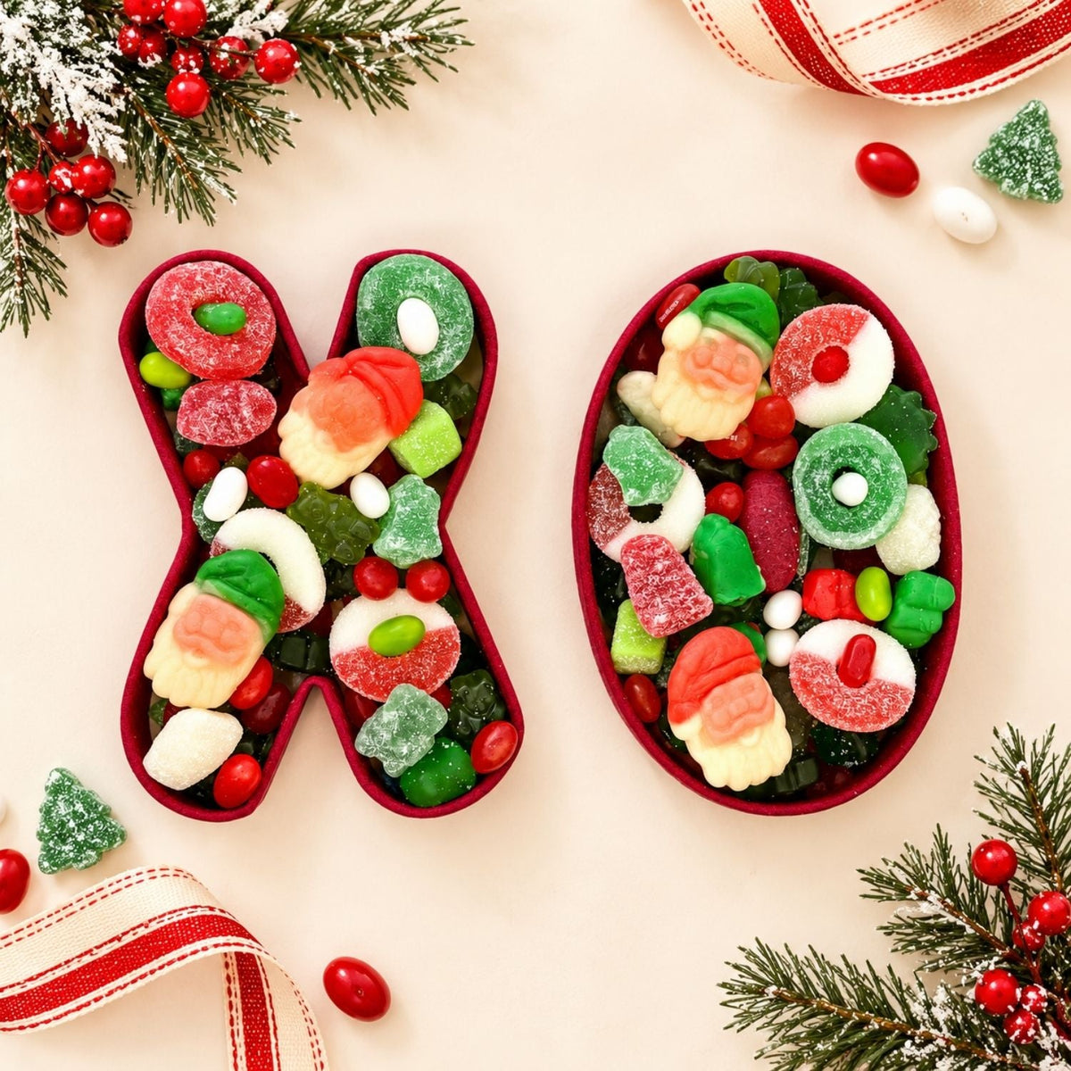 Merry Christmas XO gourmet gift trays filled with colorful treats in a festive sleeve
